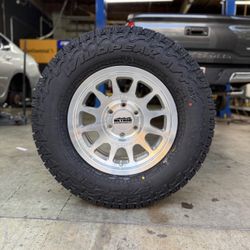 New Wheels & Tires Package Deal Method MR703 Machined 265/70R17 Falken Wildpeak AT4W Tires WE FINANC