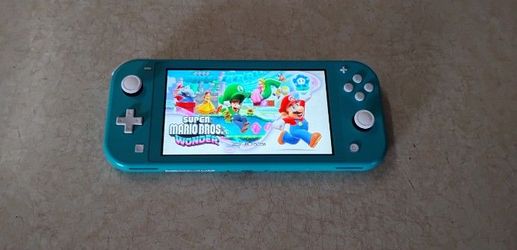 NINTENDO SWITCH LITE + 50 SWITCH GAMES INCLUDED