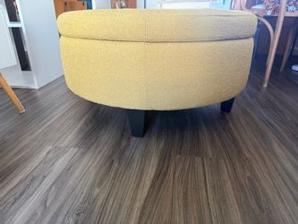 Round yellow ottoman with storage