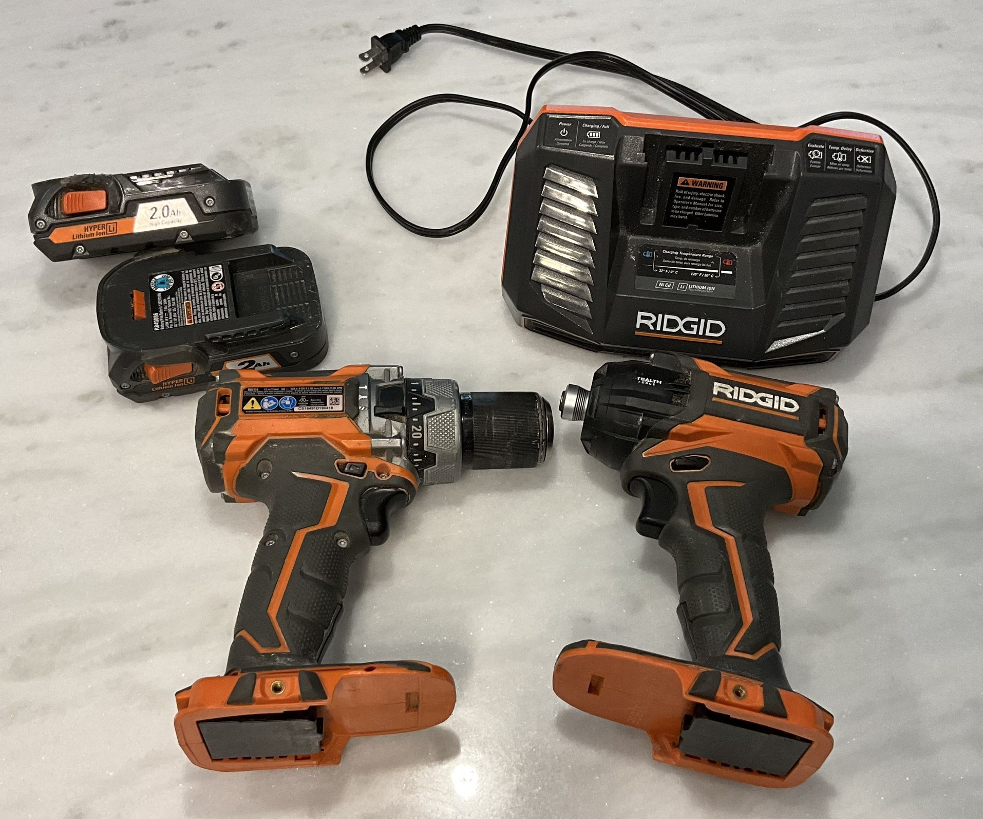 Ridgid 1/2” hammer drill, impact driver, 2 batteries & charger