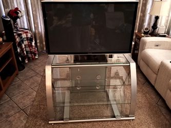Glass and steel TV stand three shelves