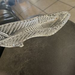 Shoe made of clear glass.Opening at the top for an air plant or whatever you wish to put in there. She pictures for beauty nice gift for anyone on ur