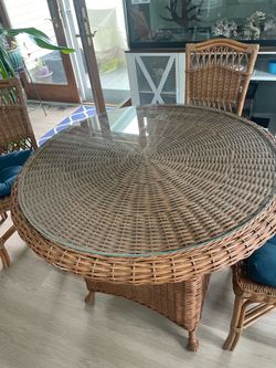 Wicker table with glass top and 4 chairs with cushions