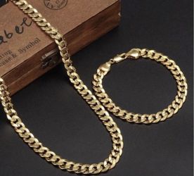 New 18 k yellow gold Cuban link chain and bracelet