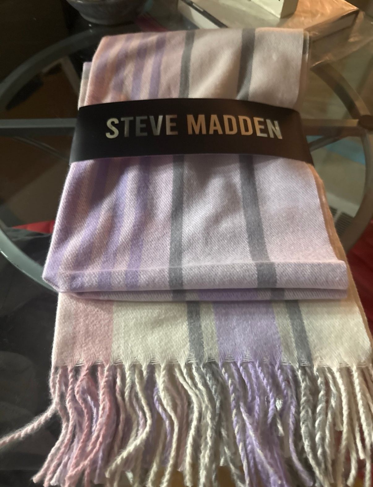 Steve Steve Madden, new purple striped, please scarf or blanket . New with tag. Shades of purple , pale pink with gray stripes. Factory Color Fades