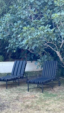 Pair of Brown Jordan Venetian sun loungers on wheels with striped upholstered cushions