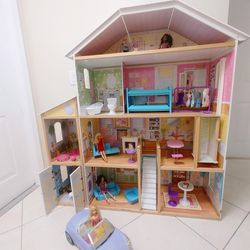 KidKraft Majestic Mansion Dollhouse with Barbies, Accessories, Working Elevator, Car and Garage