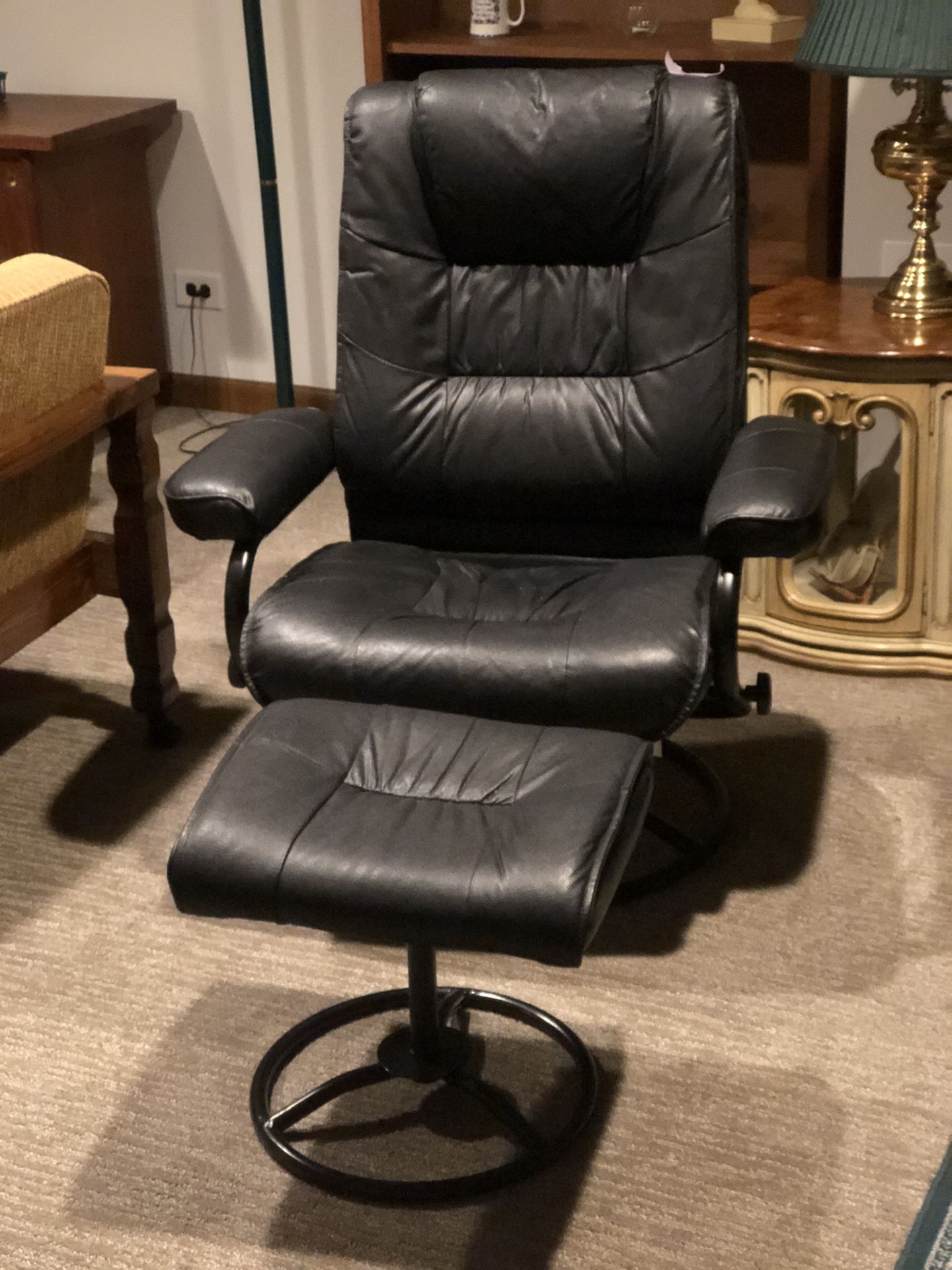 Black Leather Recliner With An Ottoman