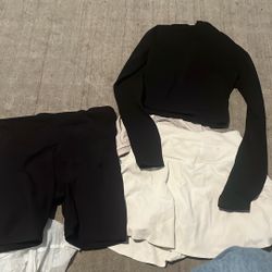 White Tennis Skirt. Black Zip Up Shirt And Black Biker Shorts