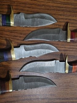 Variety Of Damascus And Bone Handle Knife