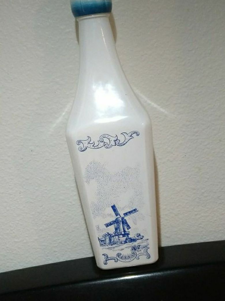 1950s? Decrotive Alcohol Bottle. [ Says on bottom] Fed Law Forbids Reuse Of Bottle. Collectable????