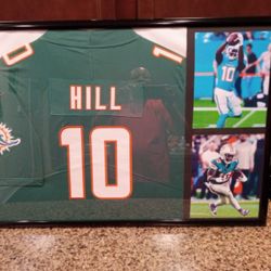 TYREEK HILL OF THE MIAMI DOLPHINS, CUSTOM STITCHED, BRANDED AND AUTHENTIC FRAMED JERSEY.