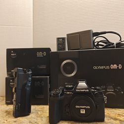 Olympus OM D EM 1 with Factory HLD 7 battery grip  and boxes