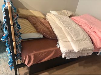 Twin bed frame with ikea mattress. Free pillows.