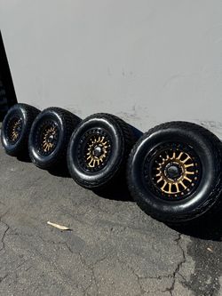 KMC KM552 IMS 6x5.5 17" Wheels Bronze With 33” Mickey Thompson Baja Boss A/Ts All-Terrain Tires