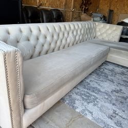 tufted, L-shaped sectional sofa with a chaise lounge. *champagne color* 