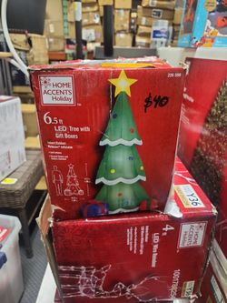 Home Accents Holiday
6.5 ft. H x 3.5 ft. W LED Airblown Holiday Lights Tree with Gift Boxes Christmas Inflatable