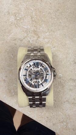 Bulova Automatic Skeleton Watch – Blue Roman Numerals