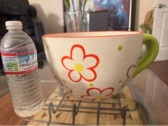 Ceramic flower pot in the shape of cup