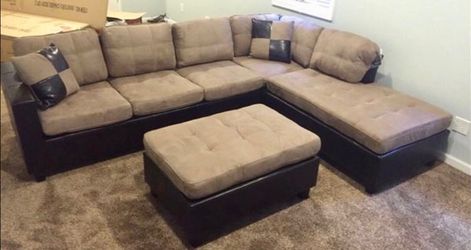 Brand new tan sectional with ottoman. Reversible chaise