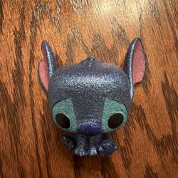 Funko Pop vinyl figure of Stitch from the Disney movie Lilo & Stitch.