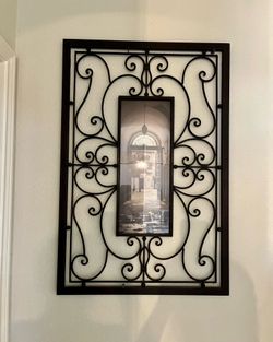 Pair of Elegant wall art featuring a black iron frame