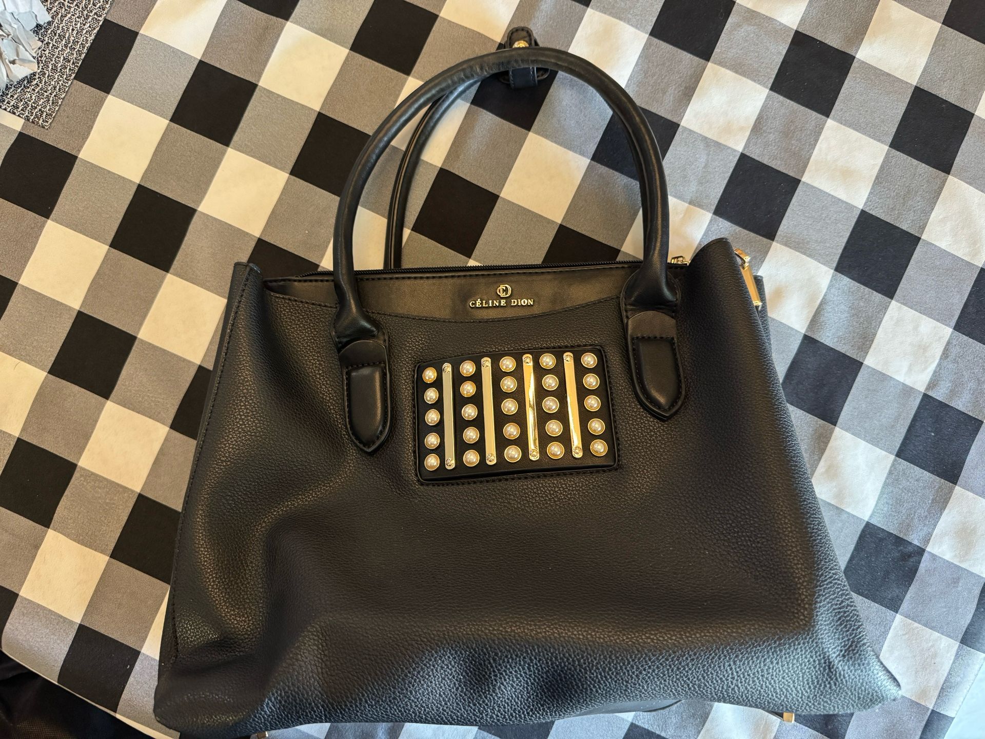 Black leather-like handbag Celine Dion collection.