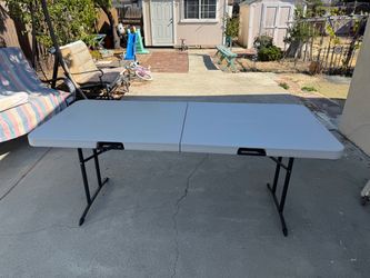 Lifetime 6-Foot Fold-in-Half white plastic Heavy Duty Folding Table  I have 3 of these available for $50 each.