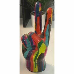 colorful peace sign hand sculpture