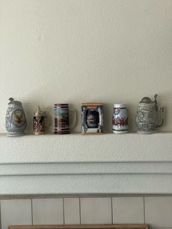 Various decorative collection steins
