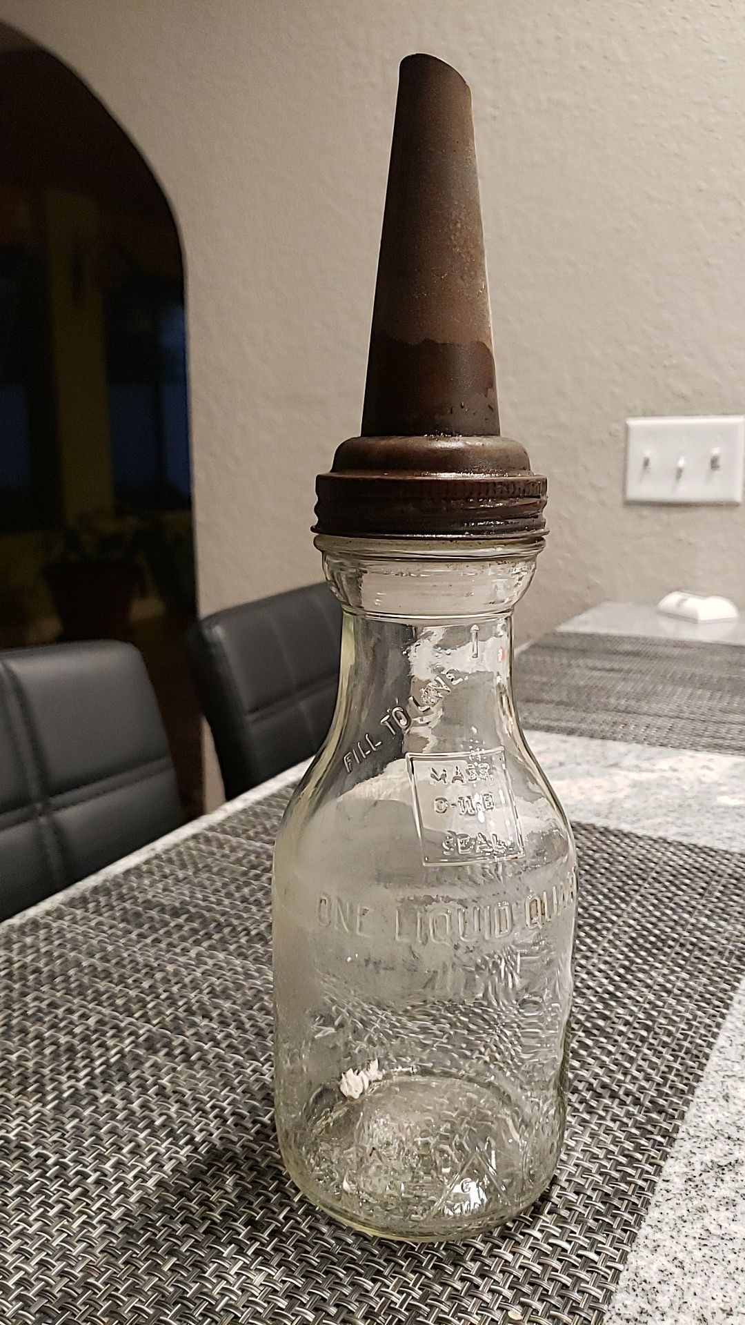 Antique glass oil bottle