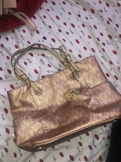 Rose gold Michael kors purse