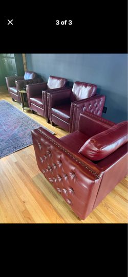 Beautiful blood red leather chairs with nail heads.