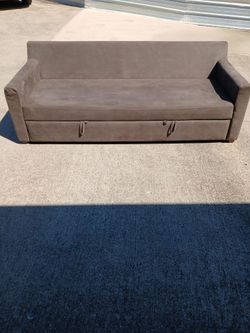 A sofa with a mini bed