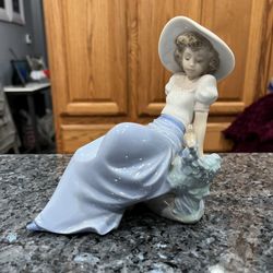 LLADRO (NAO) Figurine # 1042 Girl Listening To Songs Of Birds.  Preowned Excellent Condition.  The lighting is bad in the picture there are no white s