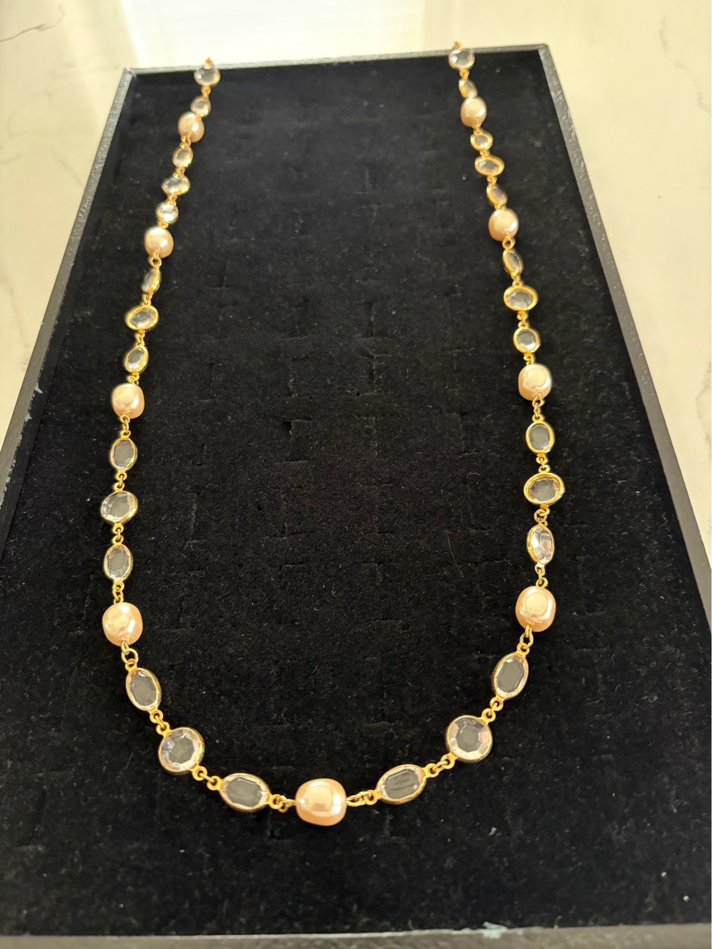 Elegant gold tone necklace, 38 inches in length