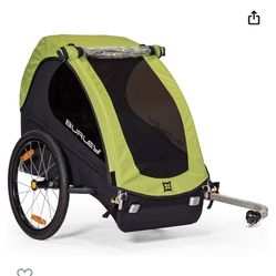  Burley Minnow Child Bicycle Bike Trailer in Green, a top-quality child trailer for outdoor enthusiasts. It is made of durable aluminum material, has 