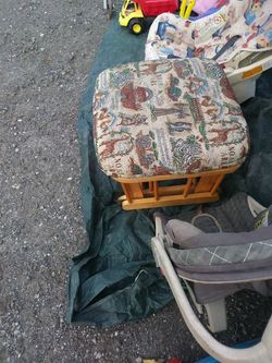 Foot stool ,with wheels on it, and rolls.