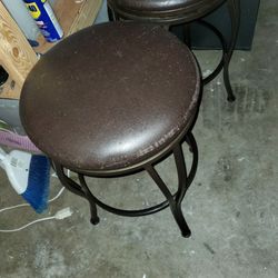 Three Dark Brown Stools