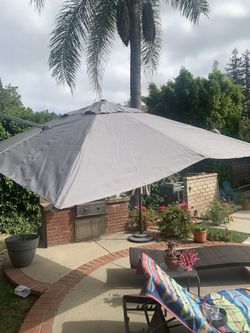 NEW PATIO UMBRELLA ADJUSTABLE 10’ X 10’ WITH BASE