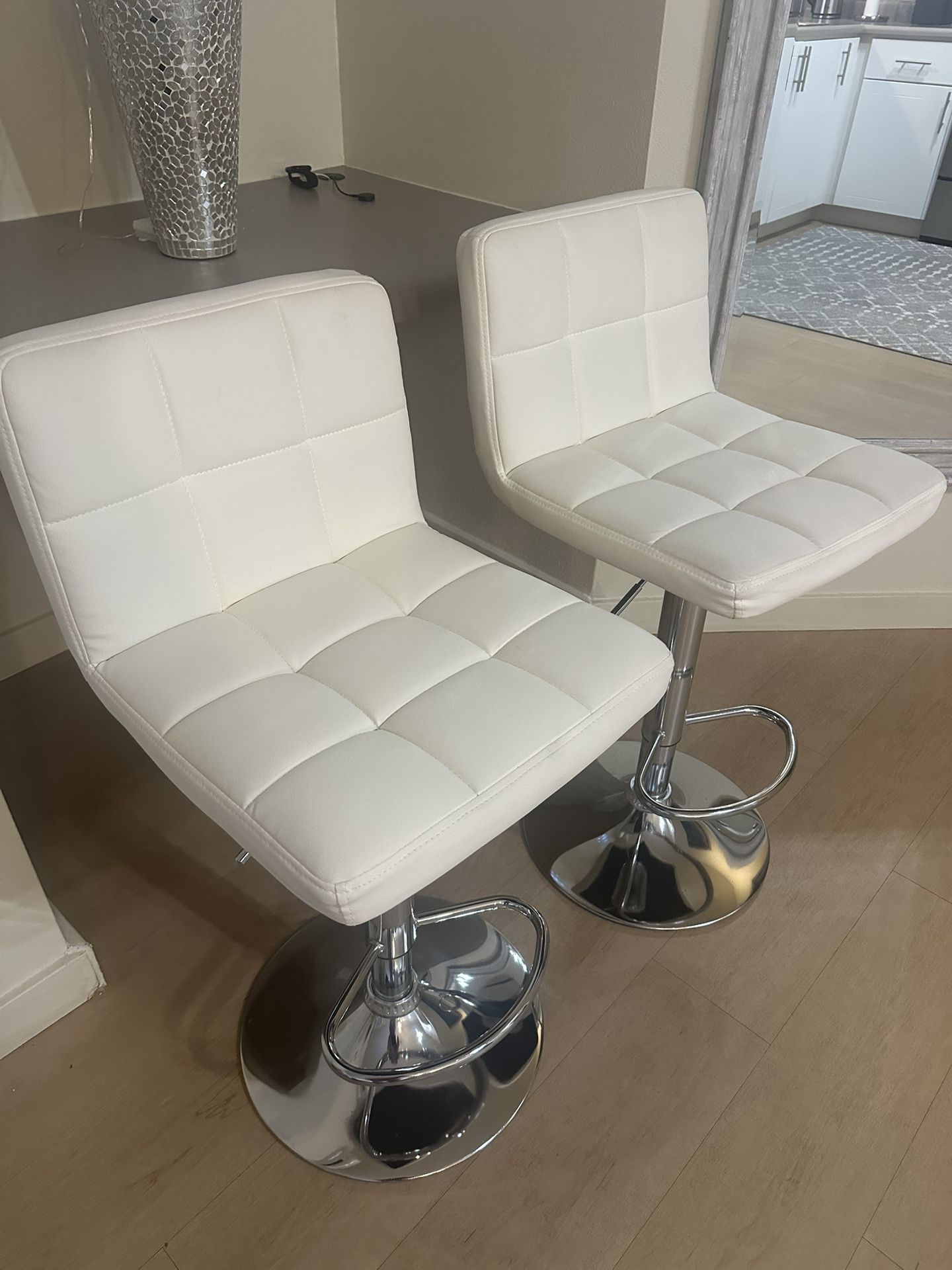2 White Swivel Bar Stools