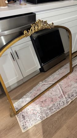 Large gold mirror and glass console