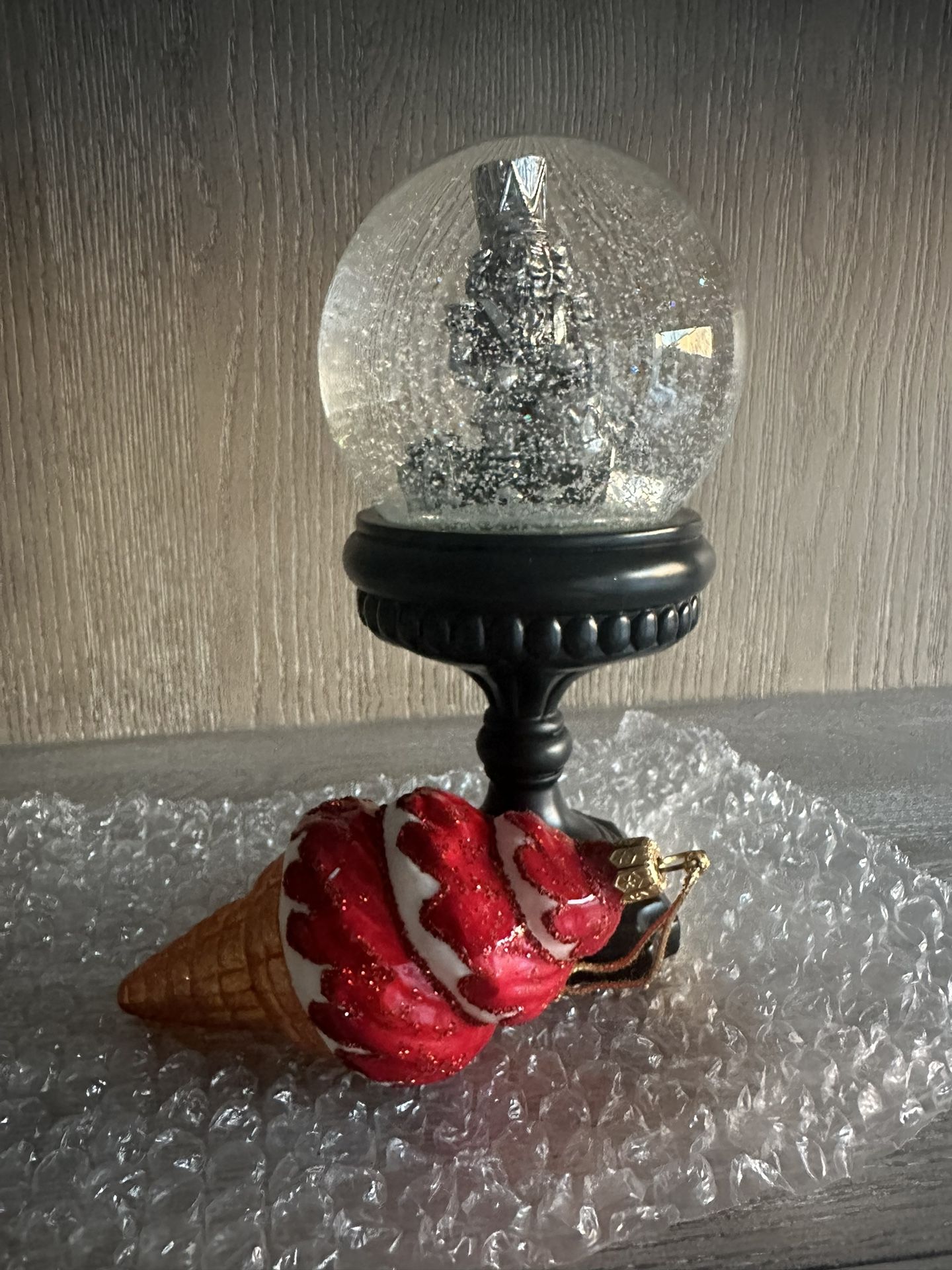 Assortment of Holiday Items (Nutcracker Snow Globe, Blown Or Ament, Collector Santa Coca Cola Glass)