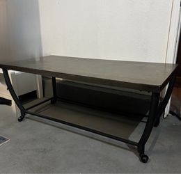 Rectangular wooden table with wheels