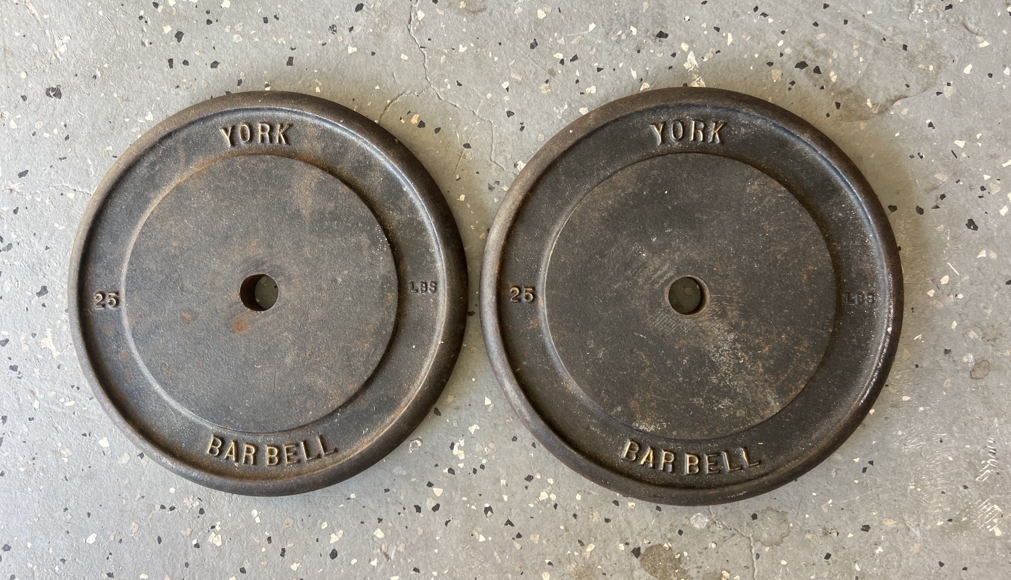York Barbell Each 25 lb standard cast iron weight plate