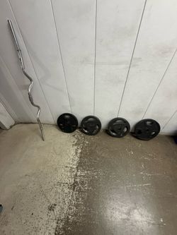 4  25lb weights and curl bar for Sale