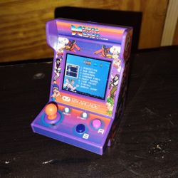 My Arcade By Data East.  Like 12 Plus Games In The Battery Operated Console   $10 Obo Used Like 2 Times Max.