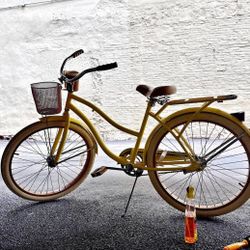 Yellow Huffy Cruiser Bike with Front Basket and Rear Rack