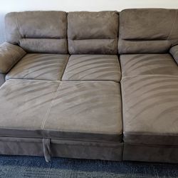 Free Delivery Today 🏠🛻. Steam cleaned sectional couch. Pullout bed and storage under chaise.  Clean Sofa! No rips or stains..