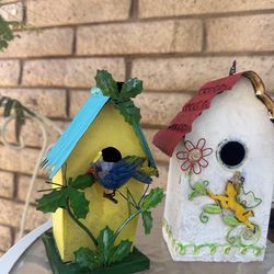 Two Adorable Bird Houses Made Out. Of Metal And A Squirrel Of Bird Feeder